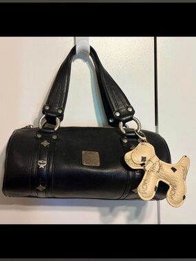 Authentic MCM Black Leather Studded Barrel  Bag & Authentic MCM dog charm & COA